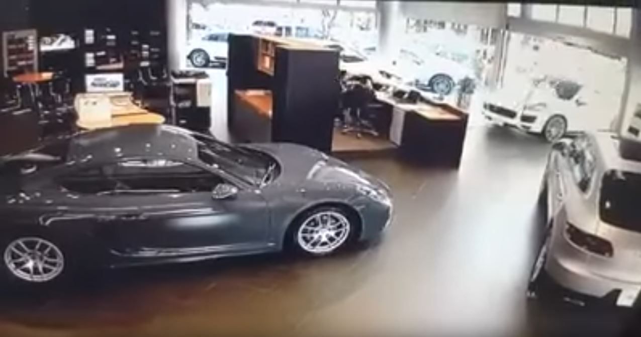 porsche-cayenne-man-smashes-into-dealer-2 Disgruntled Owner Smashes Cayenne Through Porsche Dealership After Not Getting Optional Extras