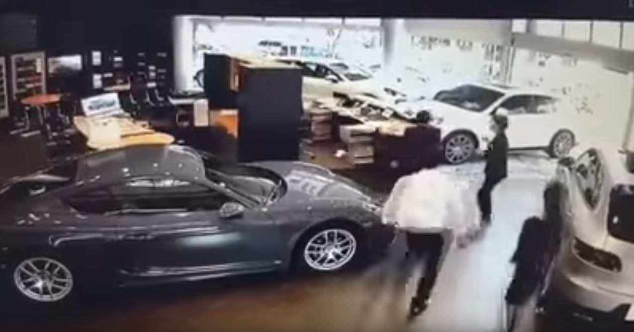 porsche-cayenne-man-smashes-into-dealer-4 Disgruntled Owner Smashes Cayenne Through Porsche Dealership After Not Getting Optional Extras