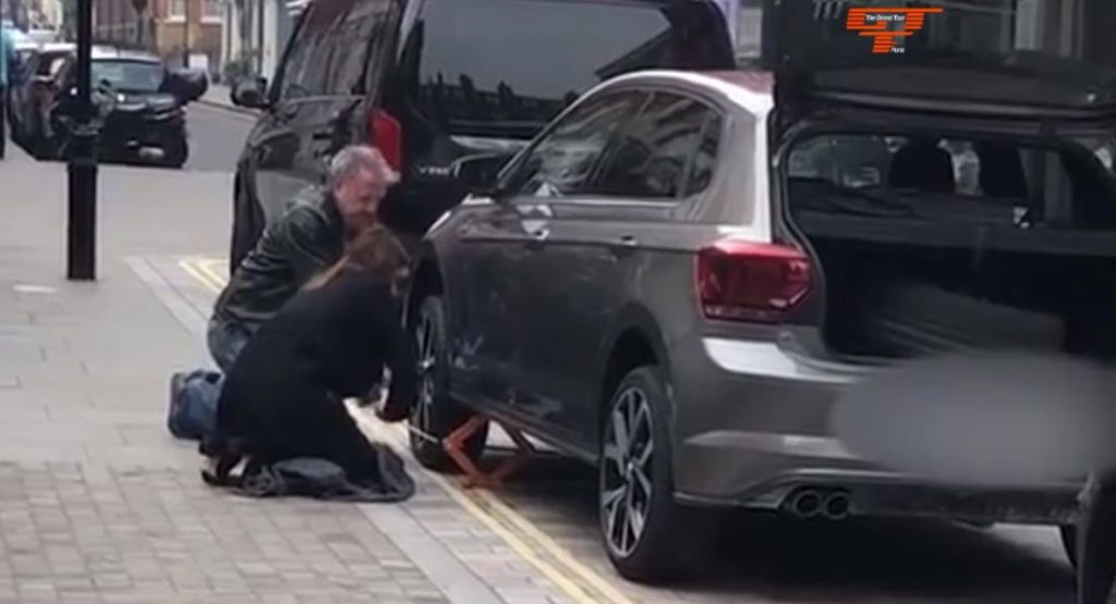  Jeremy Clarkson Caught On Street Helping Young Socialite After She Gets A Flat Tire