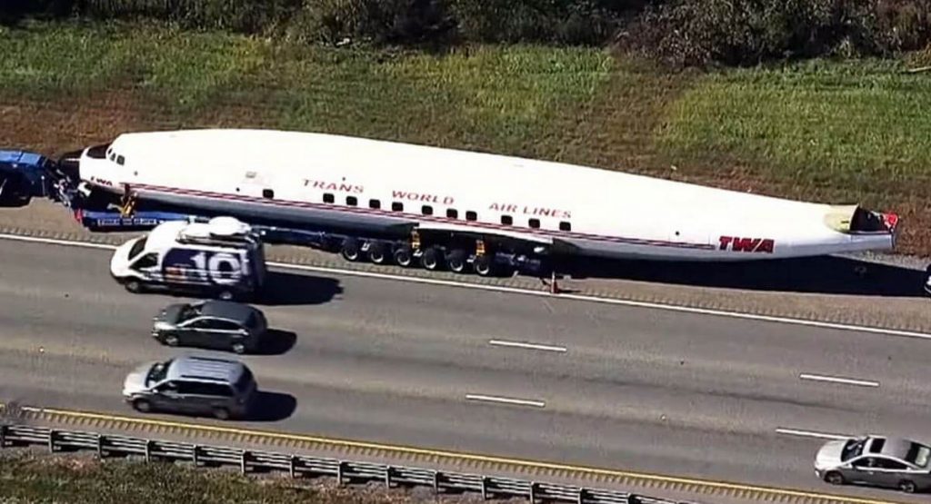 Convoy Carrying Old TWA Plane That’ll Be Converted To A Bar Stops To Fix Flat Tire