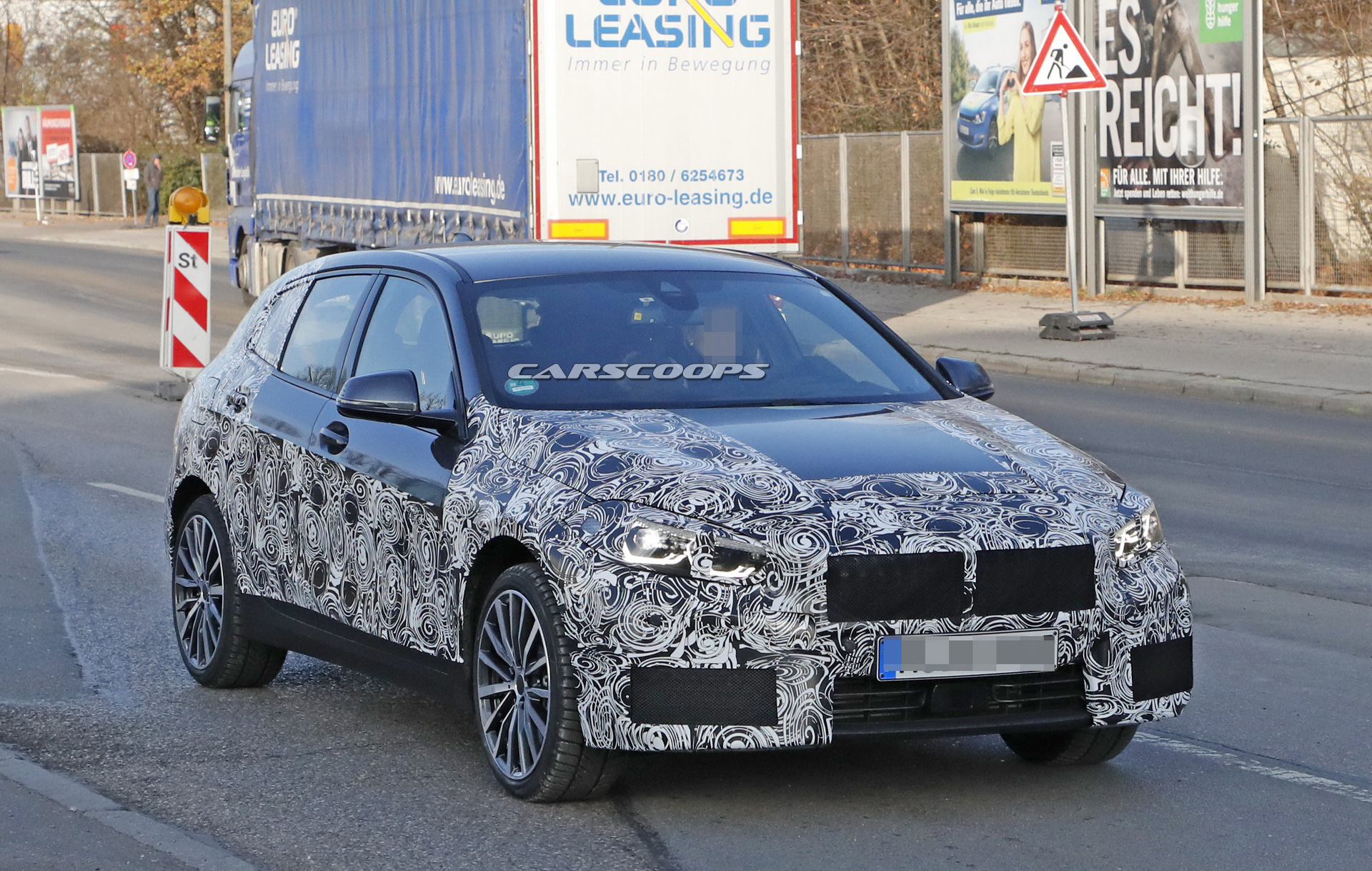 2019 bmw 1series prototype less camo 2 2019 BMW 1-Series: New Front-Wheel Drive Hatch Shows More Flesh