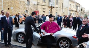 50 Kids Pull Priest In A Porsche Through The Streets Of Malta Carscoops