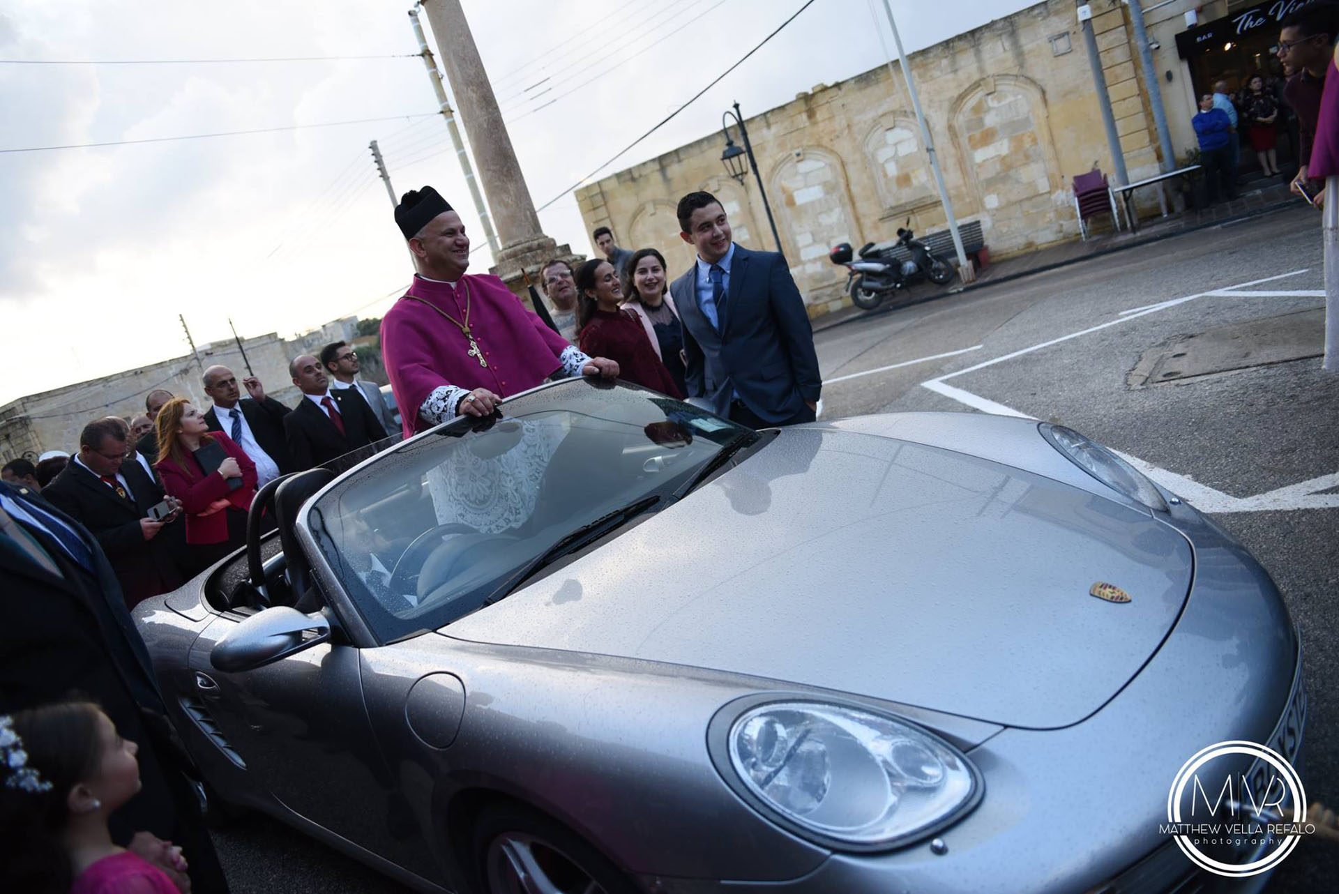 50 Kids Pull Priest In A Porsche Through The Streets Of Malta Carscoops