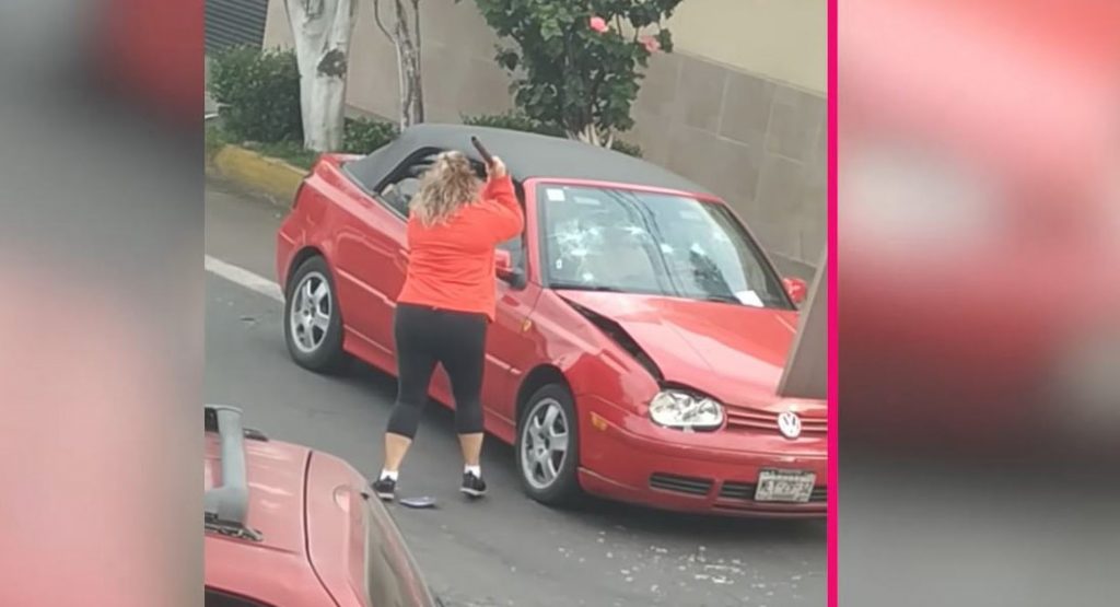  Woman Attacks VW Golf With Pipe, Then With Her Own Car