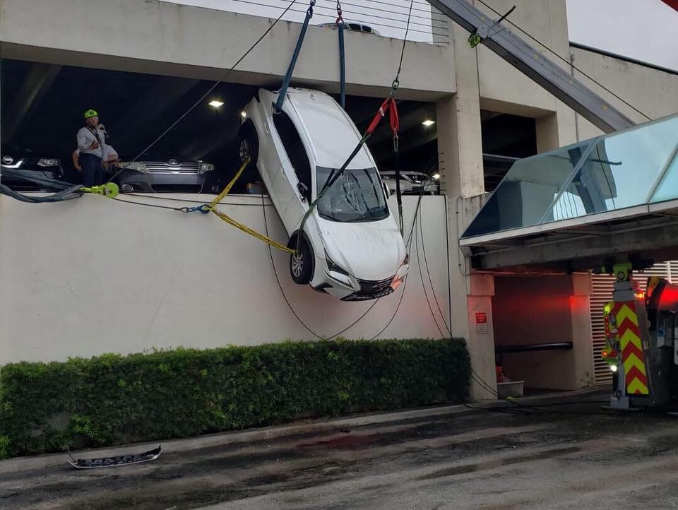 Lexus Dangles Over Parking Garage-6 Woman Crashes Lexus Through Cables And Gets Stuck Dangling Over Parking Garage