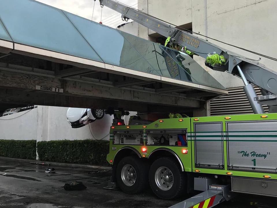 Lexus Dangles Over Parking Garage-3 Woman Crashes Lexus Through Cables And Gets Stuck Dangling Over Parking Garage