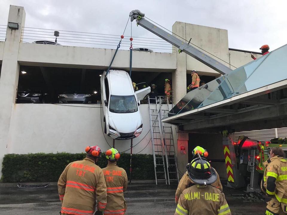 Lexus Dangles Over Parking Garage-1 Woman Crashes Lexus Through Cables And Gets Stuck Dangling Over Parking Garage