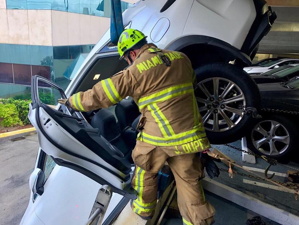 Lexus Dangles Over Parking Garage-8 Woman Crashes Lexus Through Cables And Gets Stuck Dangling Over Parking Garage