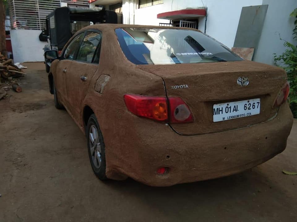 Indian Woman Coats Her Corolla In Cow Poop To Keep It Cool