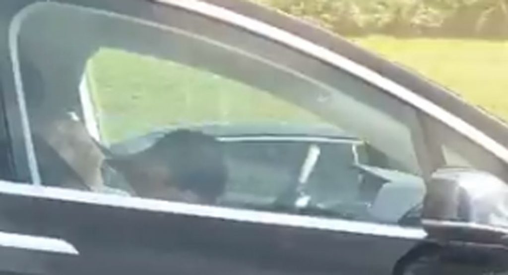  Is This Tesla Model S Driver Taking A Nap Behind The Wheel At 50-60 MPH?