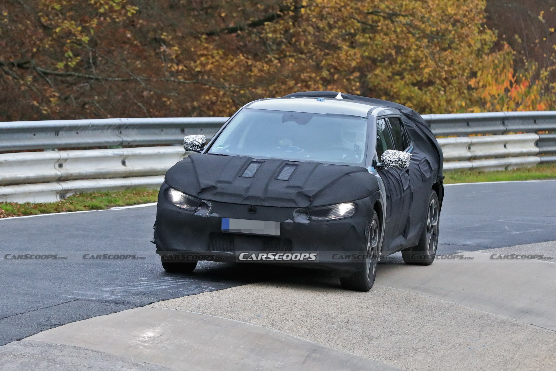 Kia Spied Testing Its All-New EV Alongside A Tesla Model 3