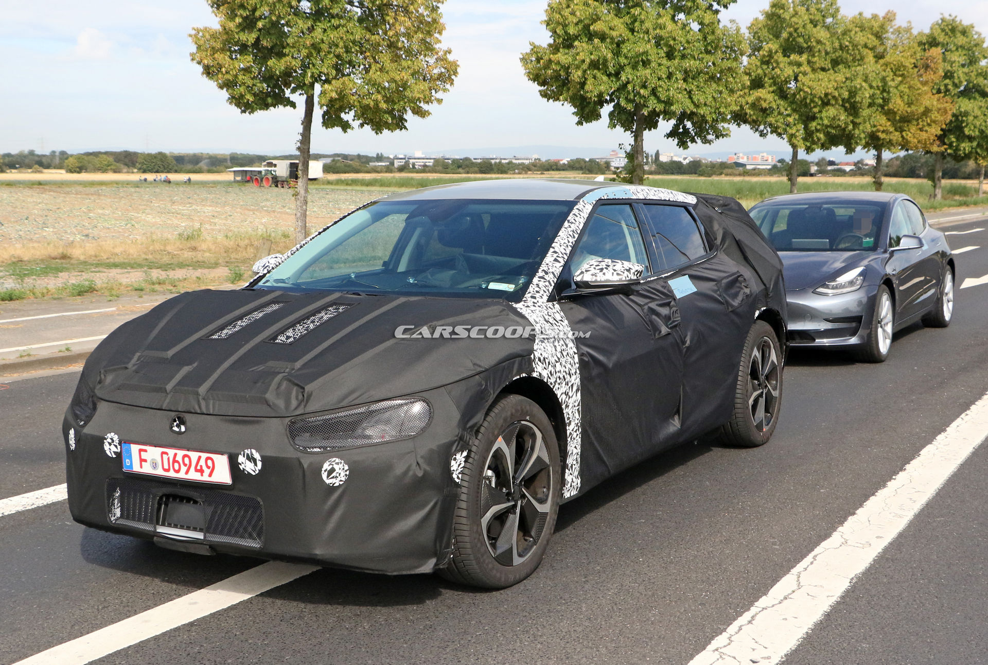 Kia Spied Testing Its All-New EV Alongside A Tesla Model 3