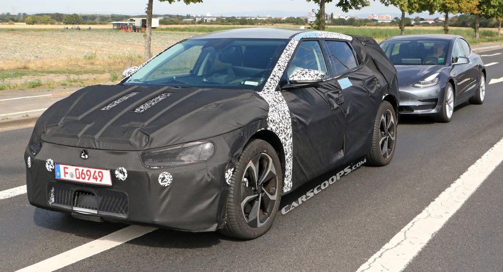  Kia Spied Testing Its All-New EV Alongside A Tesla Model 3