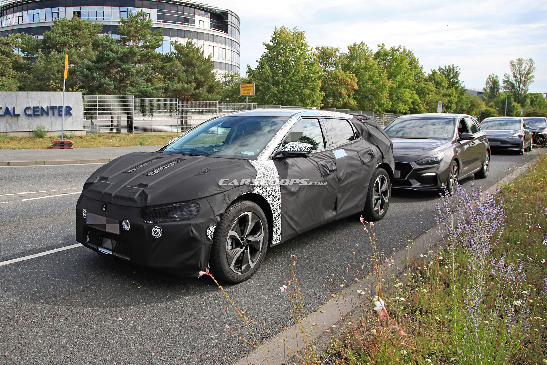 Kia Spied Testing Its All-New EV Alongside A Tesla Model 3