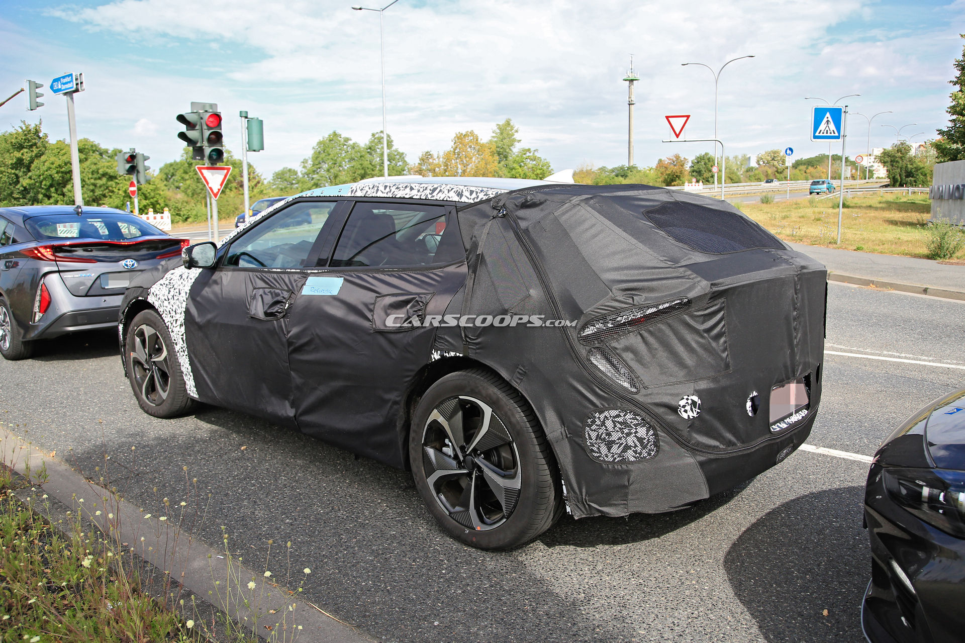 Kia Spied Testing Its All-New EV Alongside A Tesla Model 3