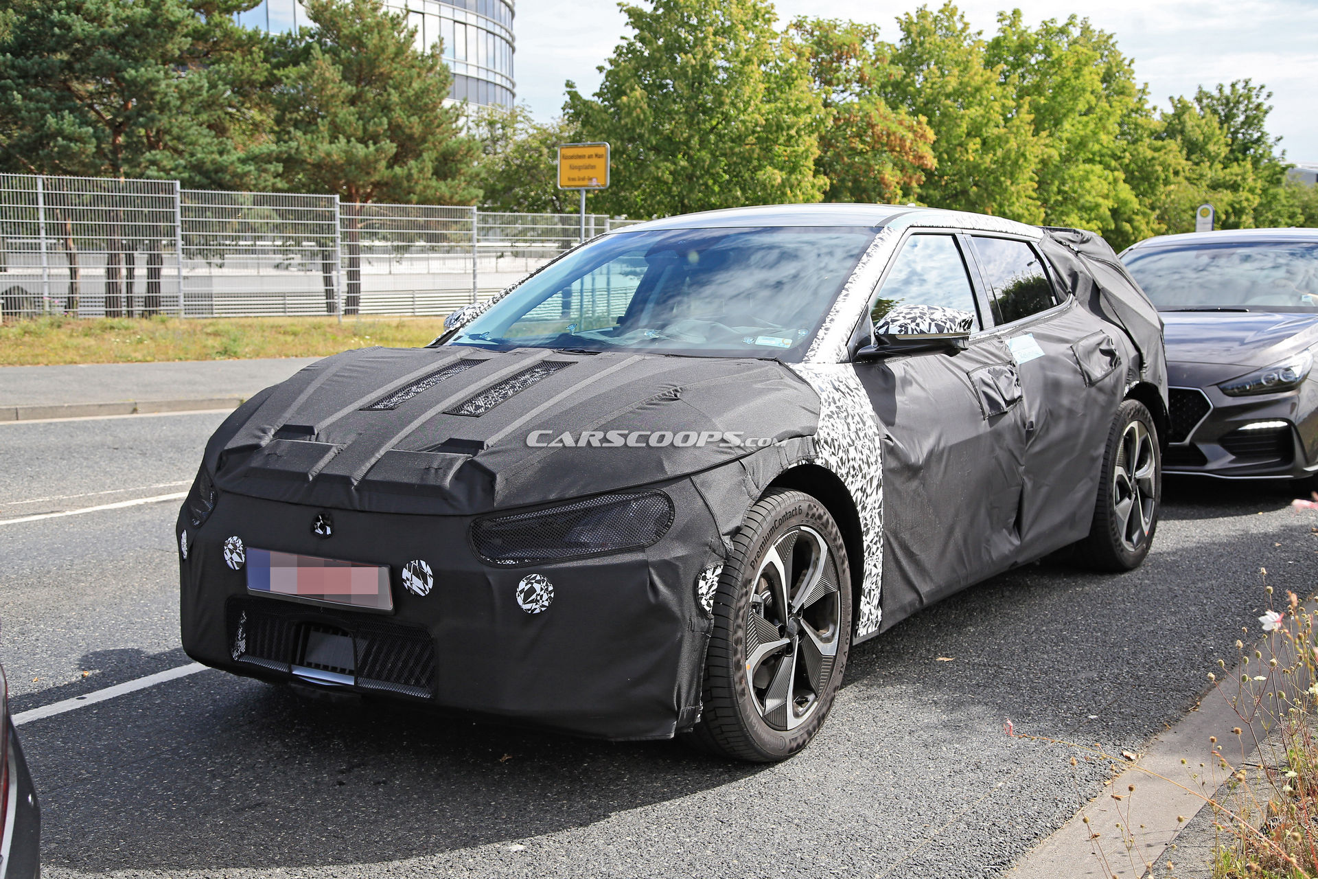 Kia Spied Testing Its All-New EV Alongside A Tesla Model 3