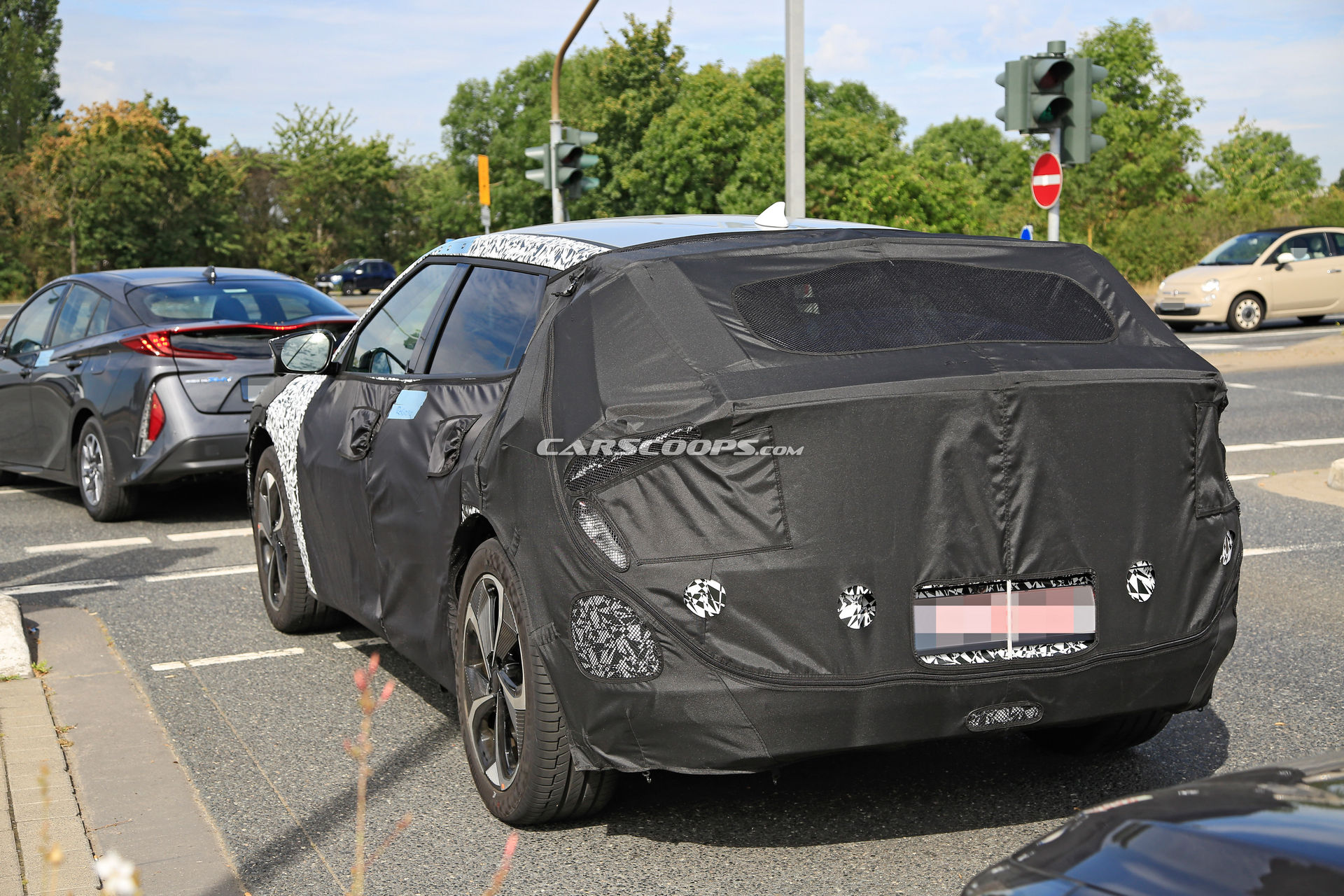 Kia Spied Testing Its All-New EV Alongside A Tesla Model 3