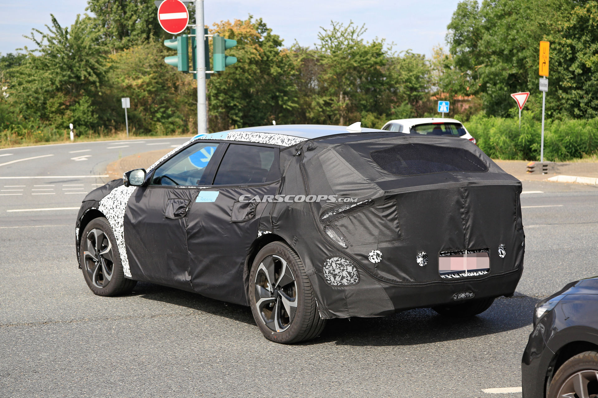 Kia Spied Testing Its All-New EV Alongside A Tesla Model 3