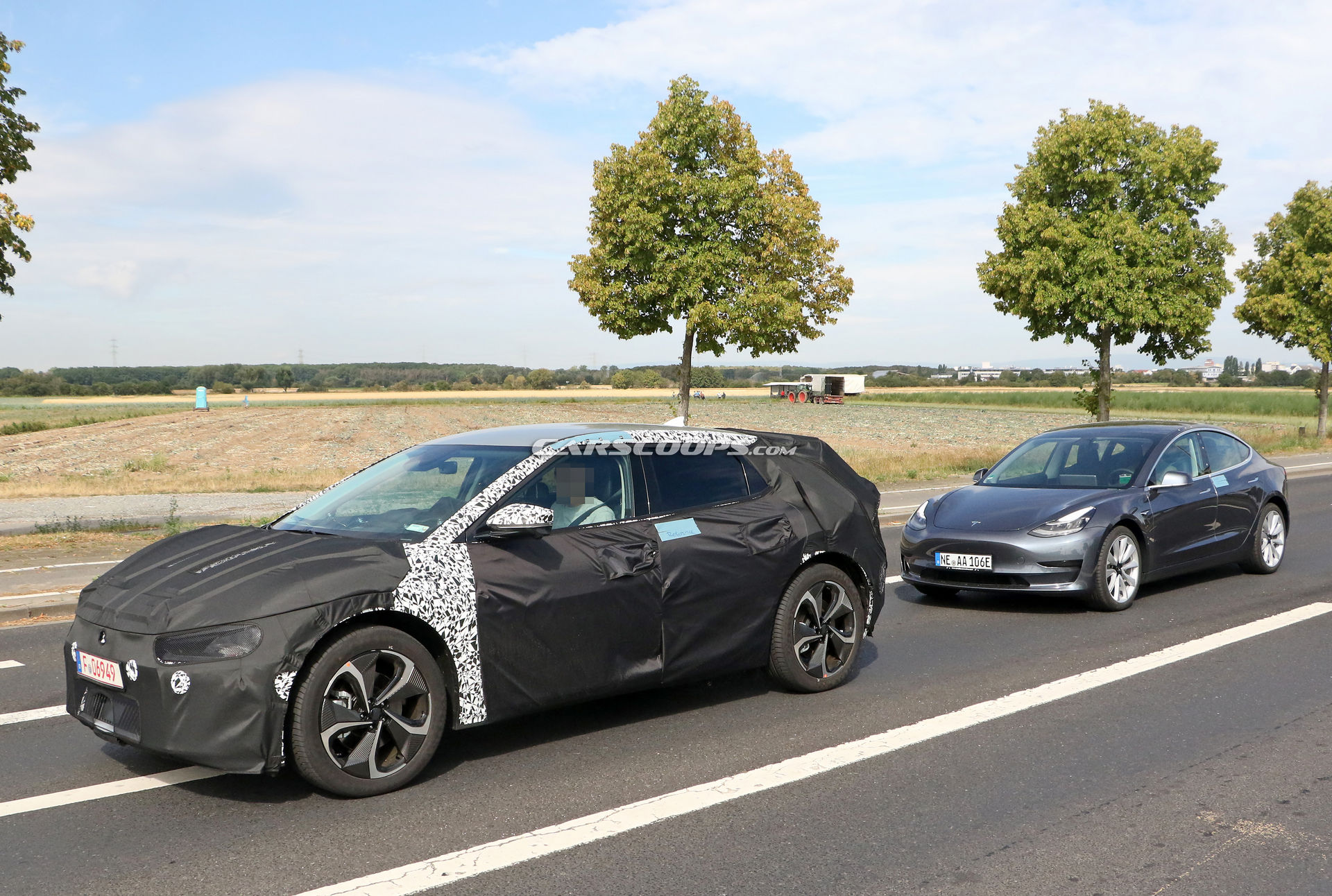 Kia Spied Testing Its All-New EV Alongside A Tesla Model 3