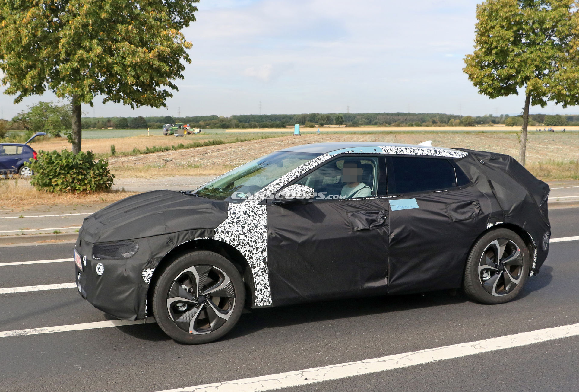 Kia Spied Testing Its All-New EV Alongside A Tesla Model 3