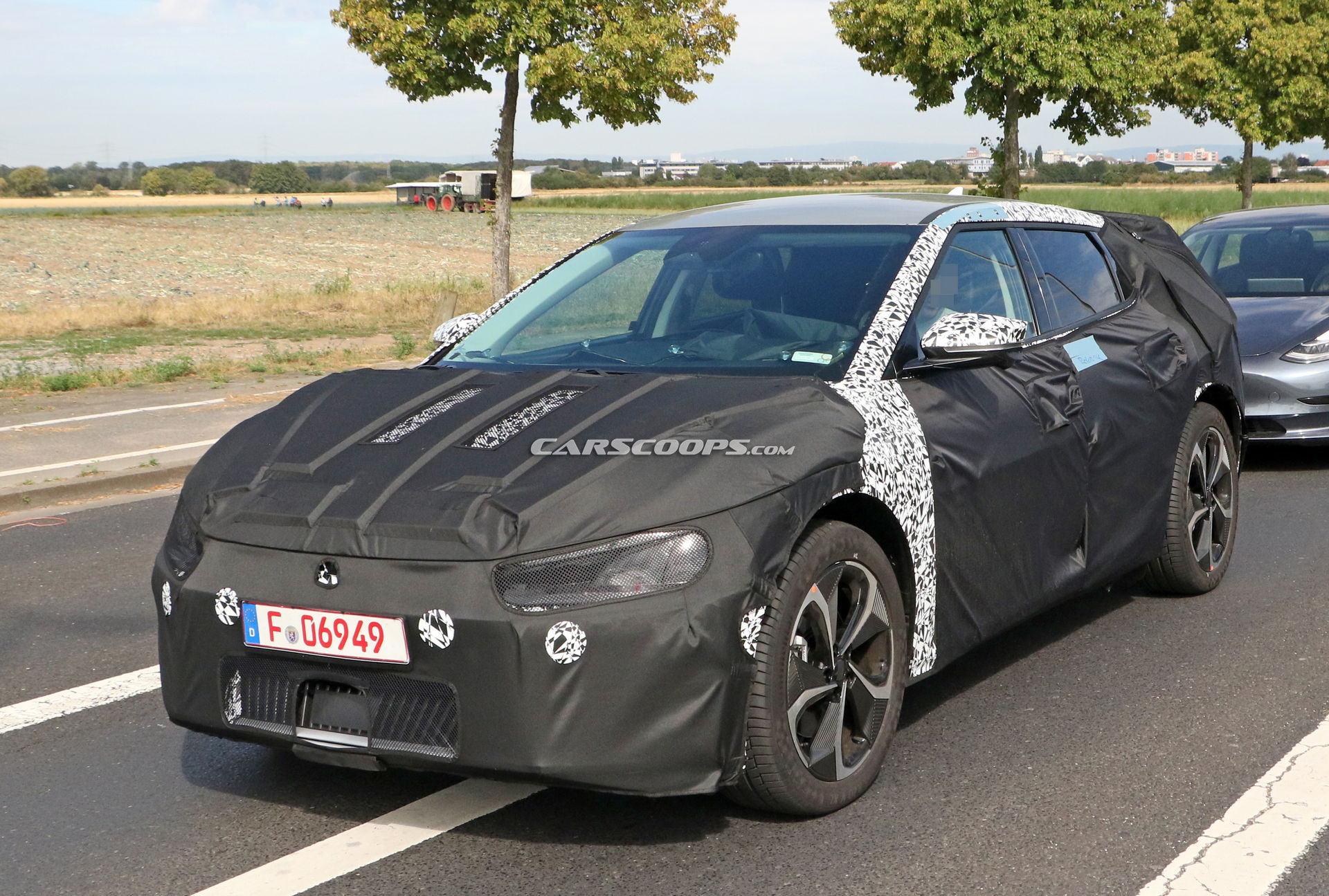 Kia Spied Testing Its All-New EV Alongside A Tesla Model 3