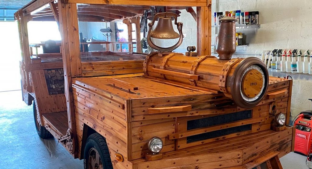  Believe It Or Not, There’s A Jeep Commander Hiding Under This Wooden ‘Locomotive’