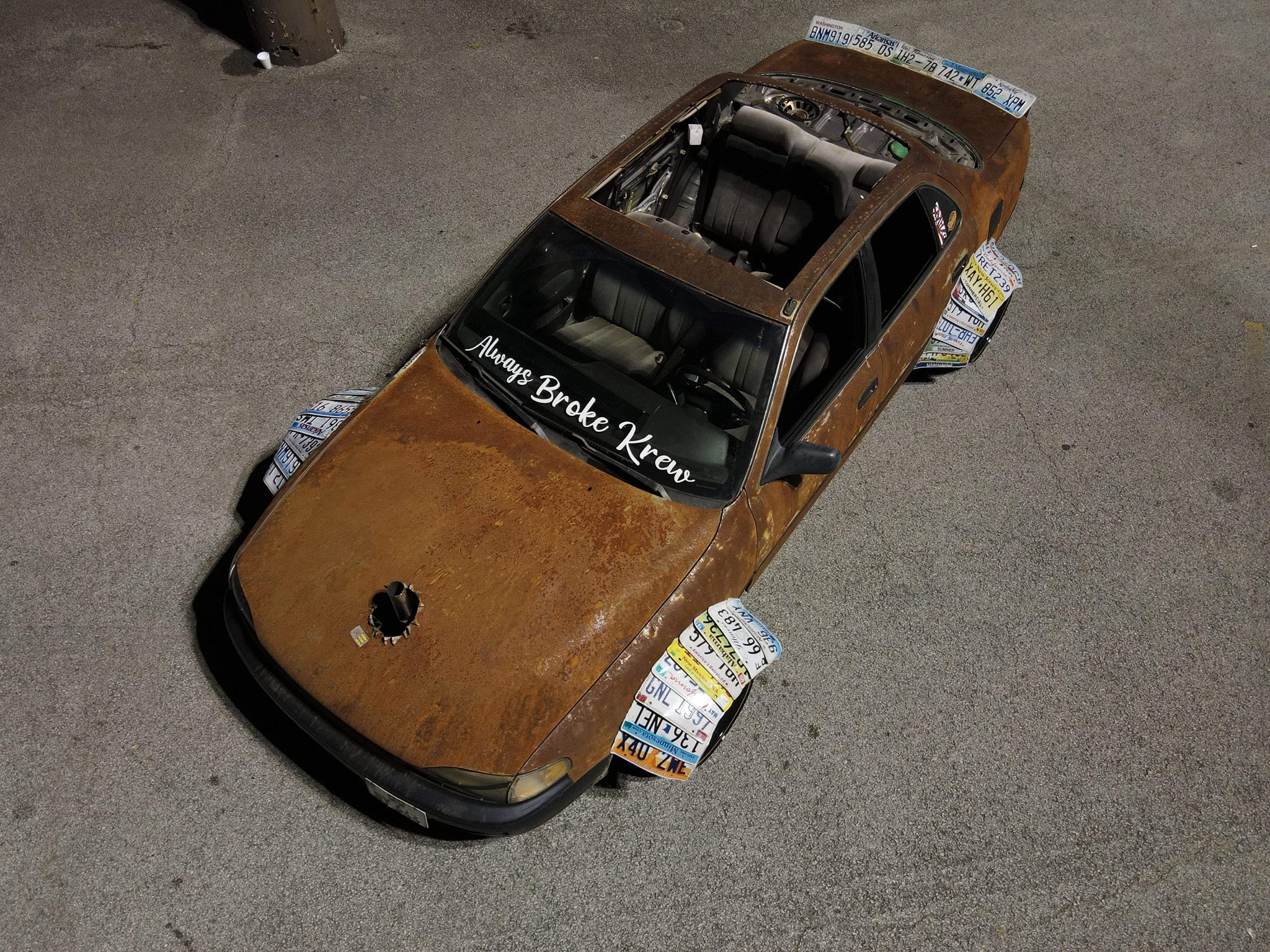 This Rusted Toyota Camry Has Fender Flares Made From License Plates