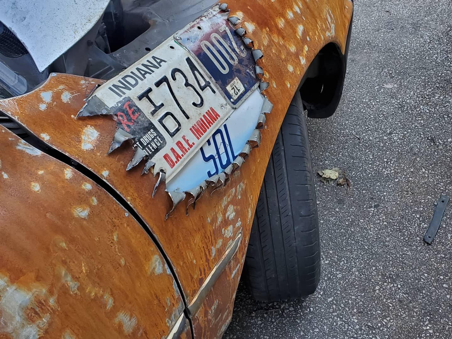This Rusted Toyota Camry Has Fender Flares Made From License Plates