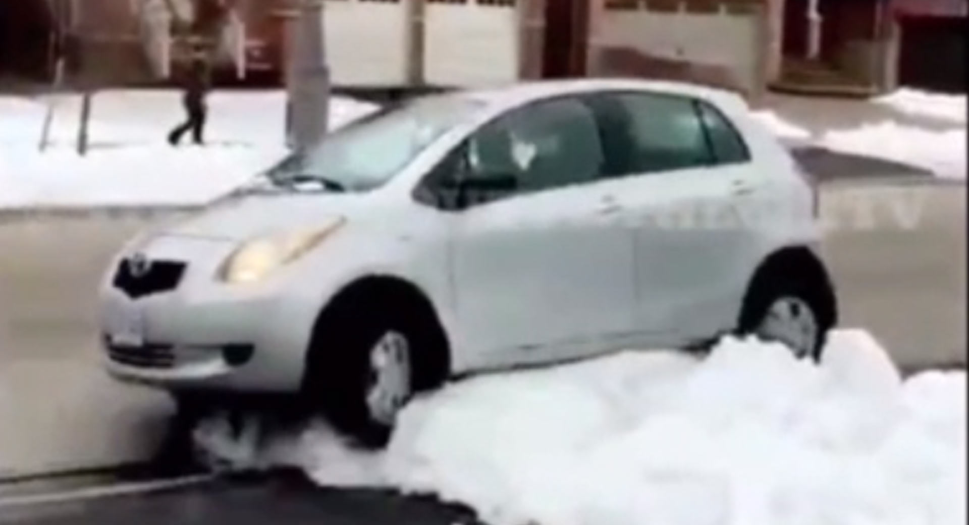 Porch pirate gets instant karma as his car gets stuck in the snow trying to escape