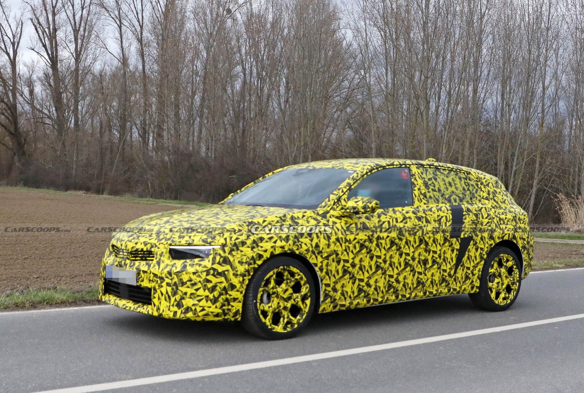 2022 Opel Astra Makes Spy Debut With A Not-So-Subtle Yellow Camo Wrap