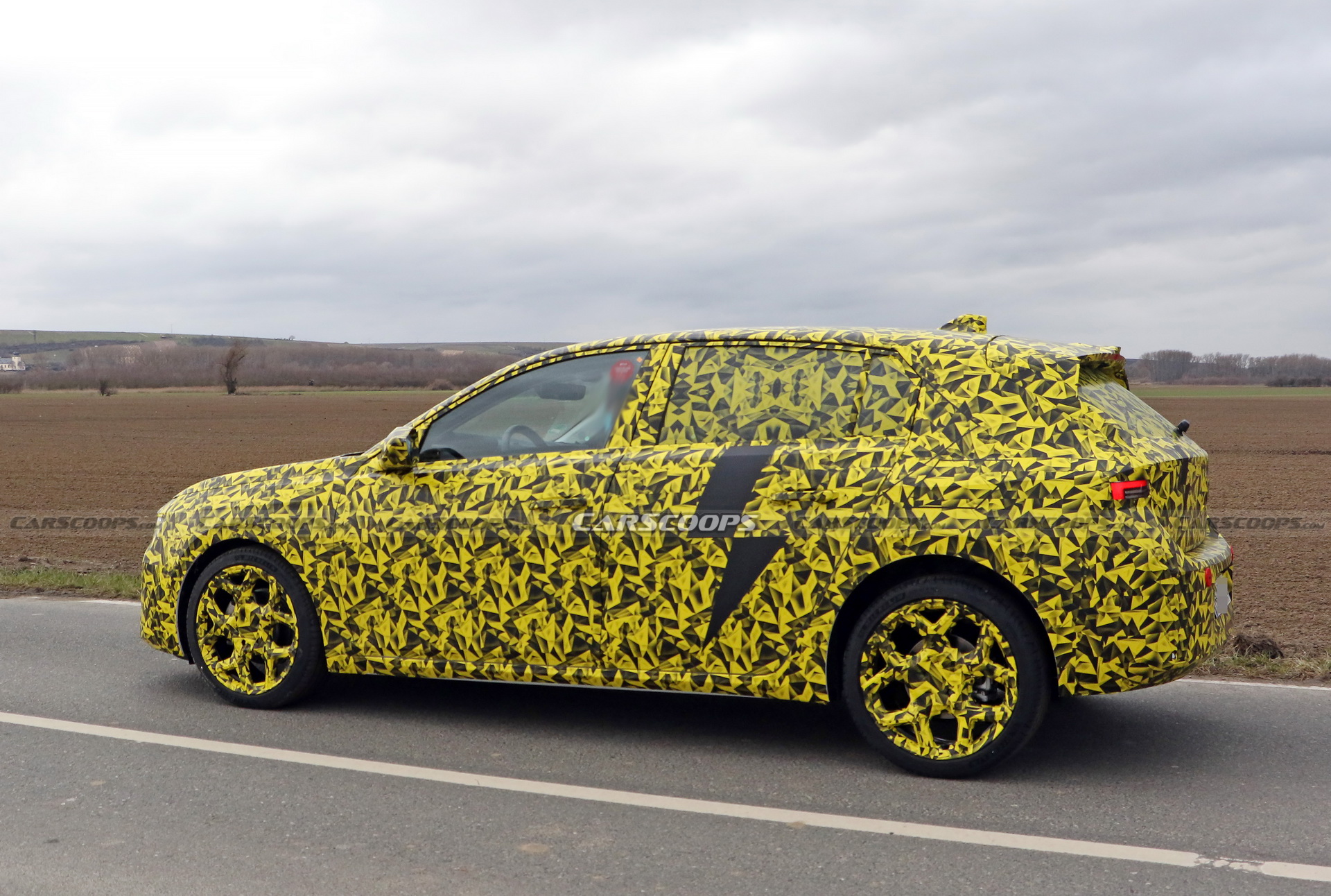 2022 Opel Astra Makes Spy Debut With A Not-So-Subtle Yellow Camo Wrap