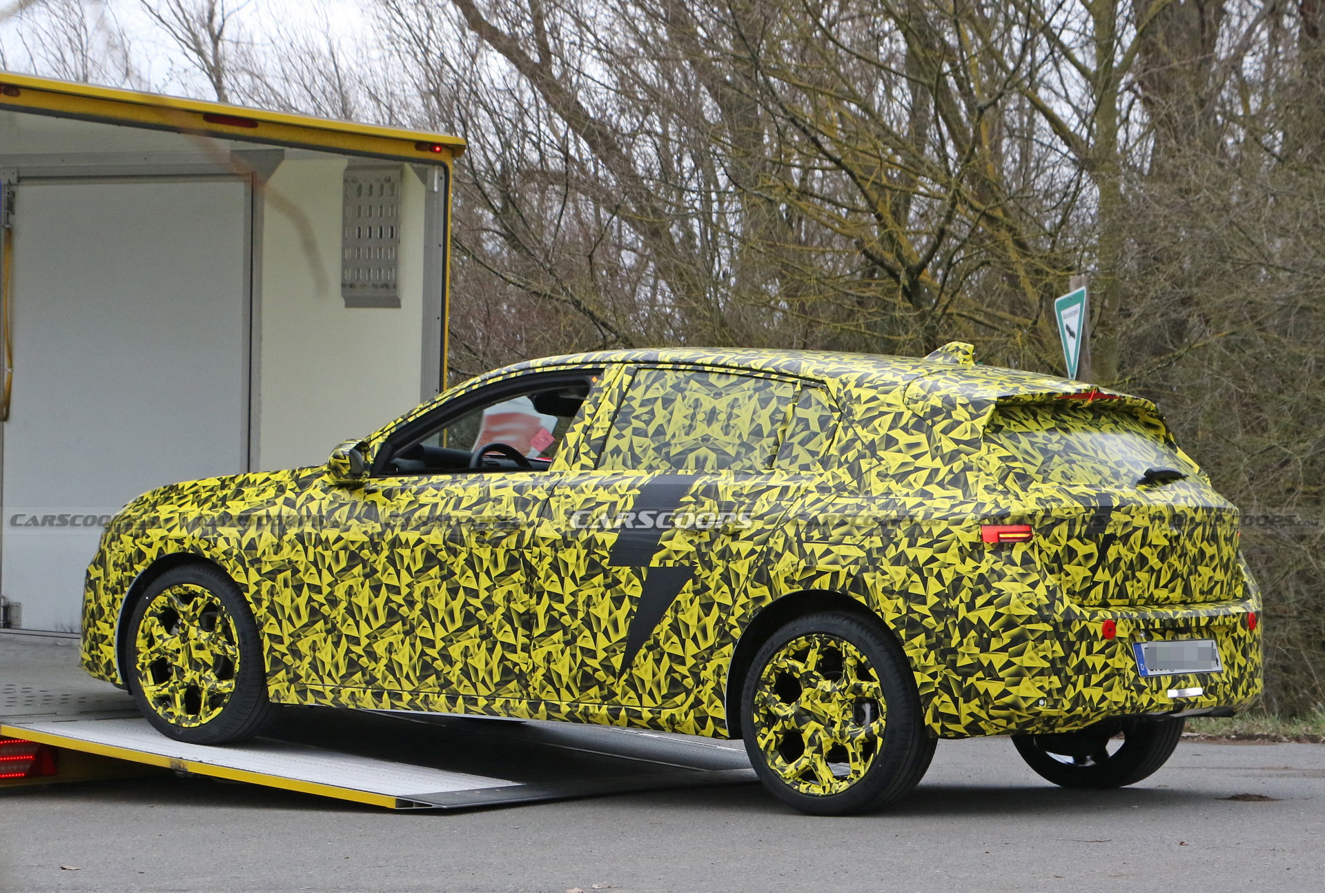 2022 Opel Astra Makes Spy Debut With A Not-So-Subtle Yellow Camo Wrap