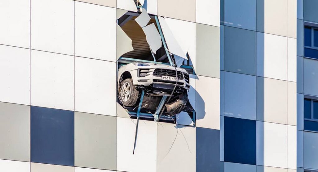  Porsche Macan Almost Crashes Out Of Multistory Parking Lot In Russia