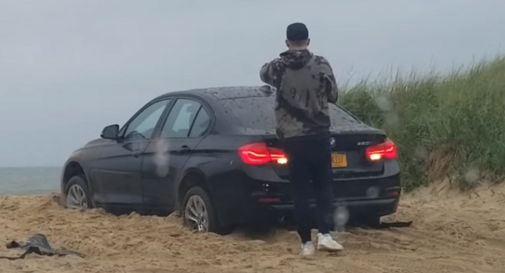 Man Locks Himself Out Of BMW, Watches As It Digs Itself In The Sand