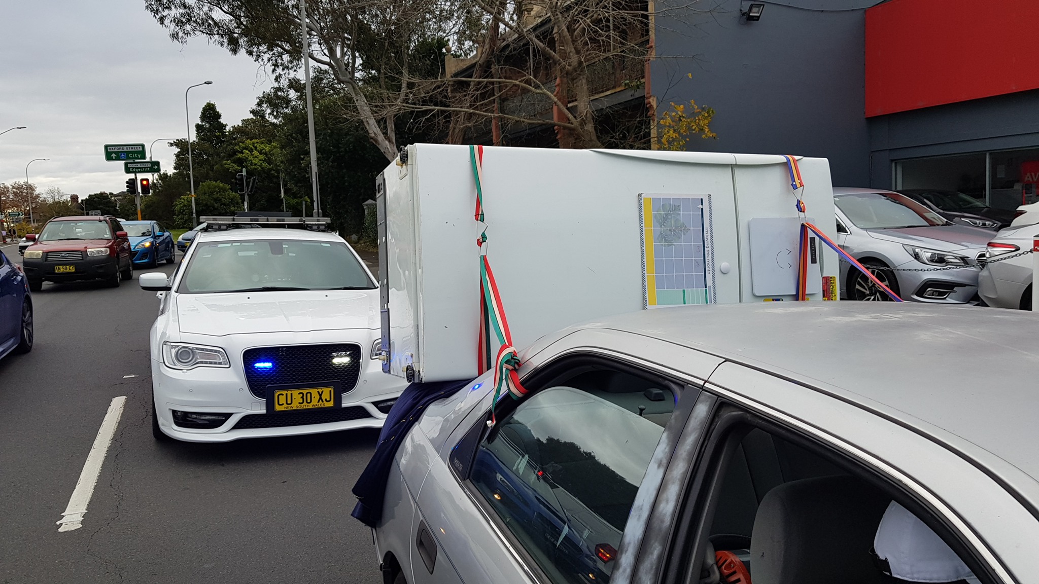 Aussie Tries To Carry Fridge On A Toyota Camry, Police Aren’t Impressed