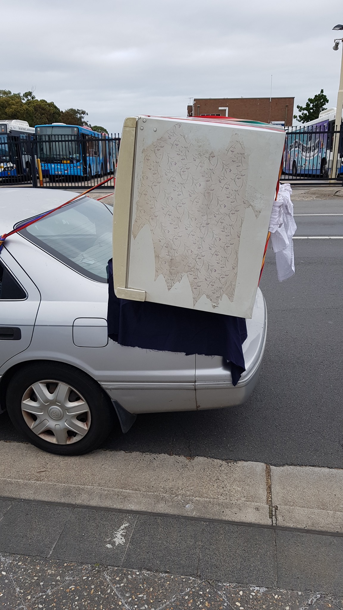 Aussie Tries To Carry Fridge On A Toyota Camry, Police Aren’t Impressed