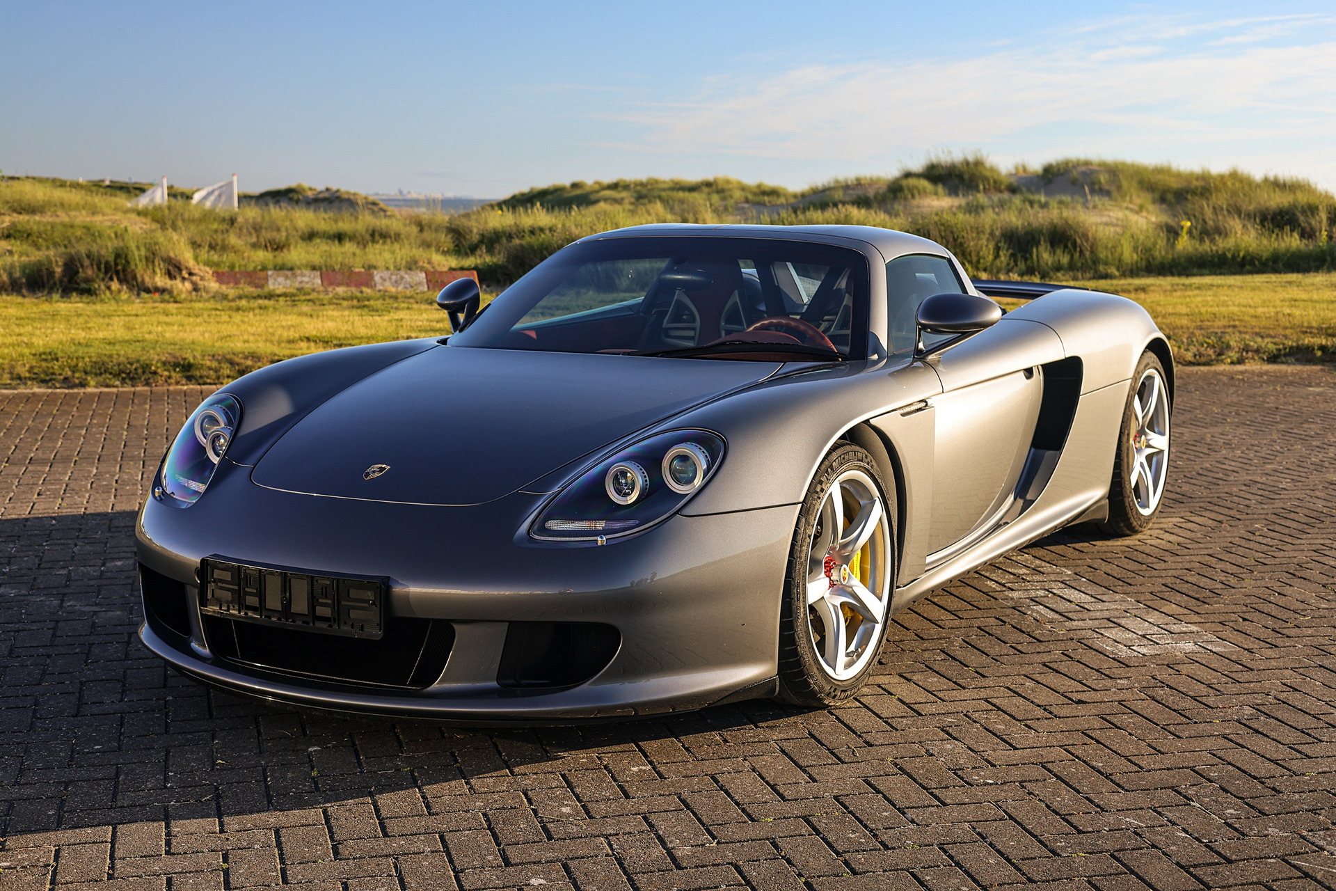 Porsche Carrera GT Once Owned By F1 Champ Jenson Button Sells Just Shy Of $1M