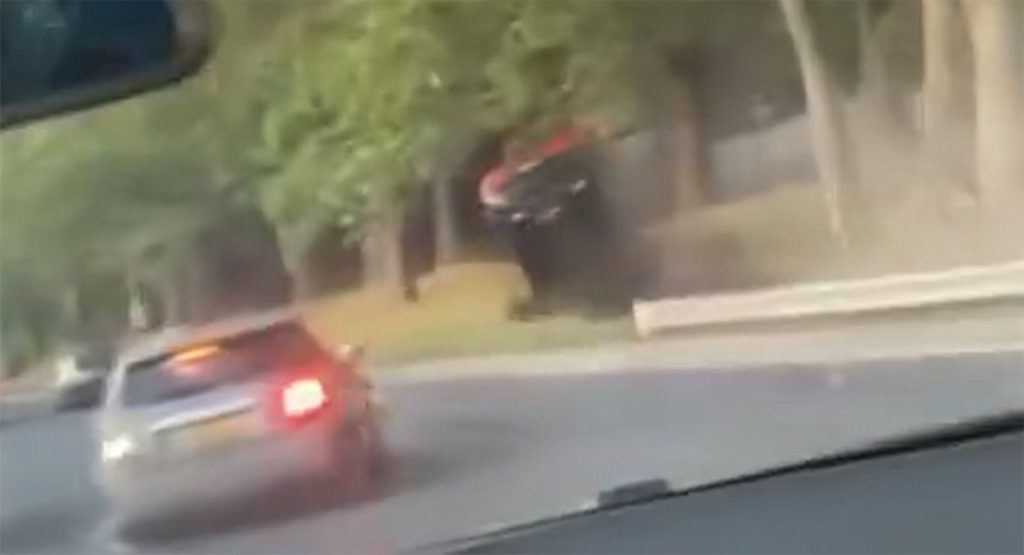 Speeding BMW Driver Sideswipes Two Cars, Flips After Hitting A Tree