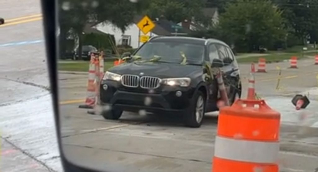 Carefree BMW Owner Drives Through Construction Zone, Picks Up Several Souvenirs