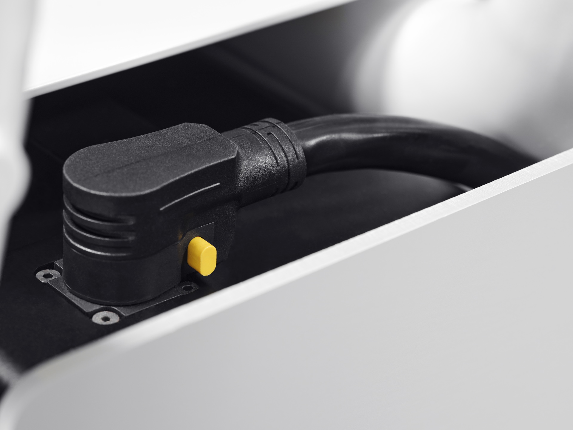 The Cake Makka Electric Moped Charges As Its Being Carried By The Polestar 2