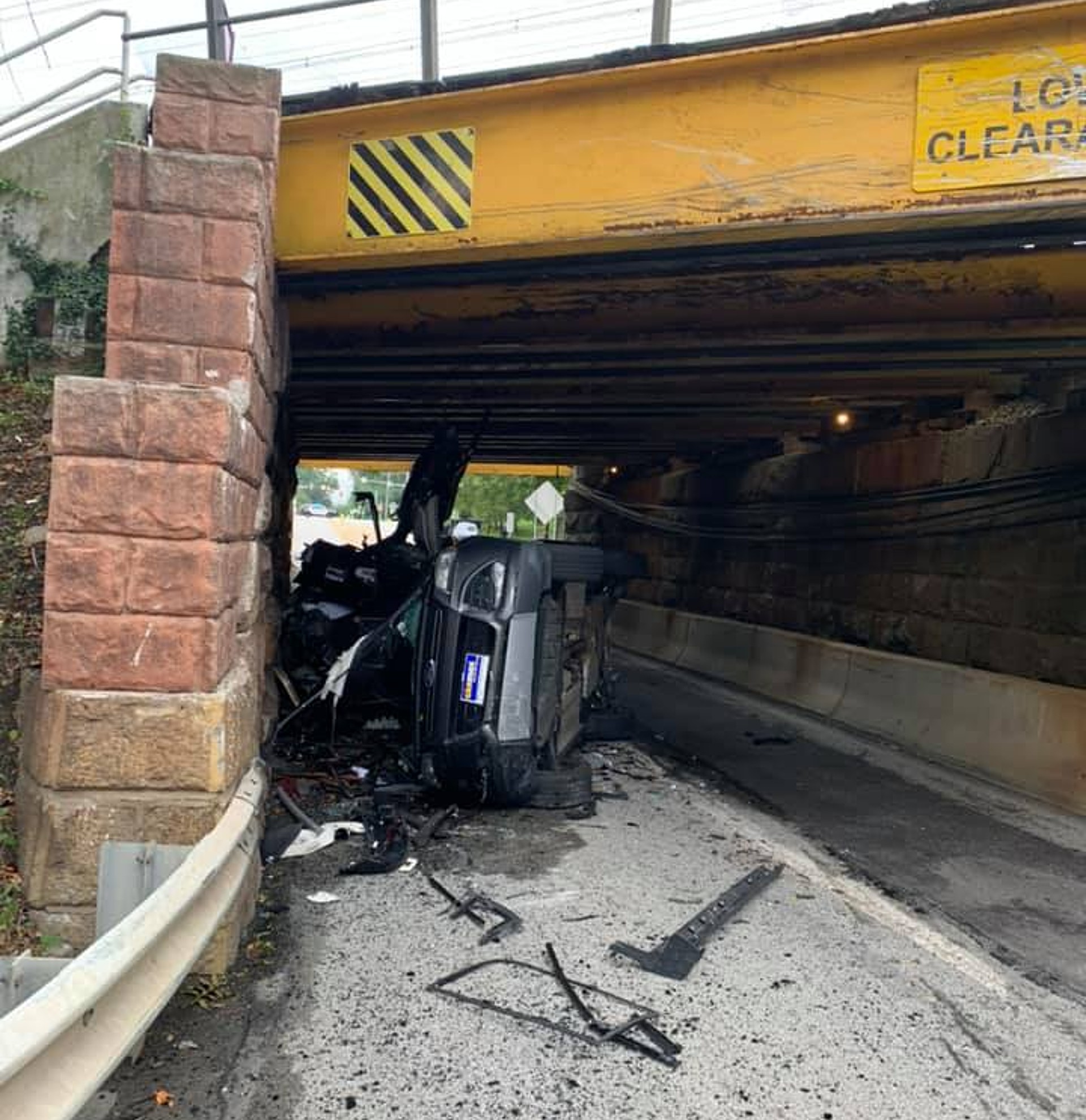 Car Carrying Trailer Crashes Into A Low Bridge Wrecking Two SUVs