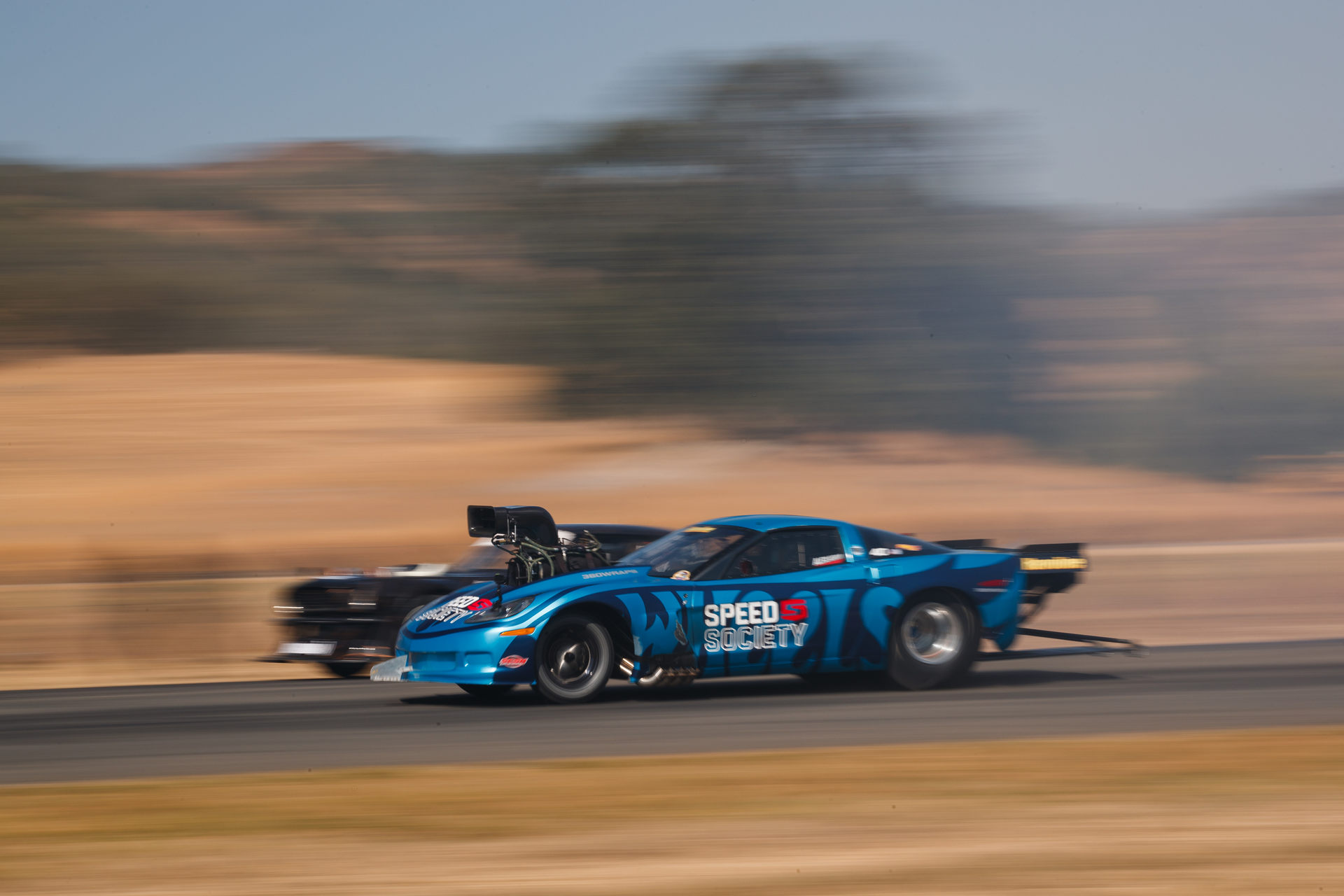 Ken Block’s 14-Year-Old Daughter Races The Hoonicorn Against A 4,000 HP NHRA Corvette