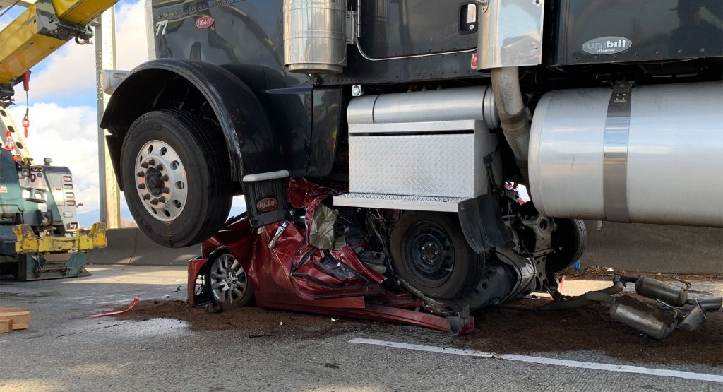  Nissan Altima Driver Somehow Survives Car Being Crushed By Semi-Truck