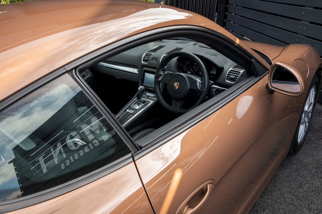 Does This Cognac Metallic Porsche Cayman Do It For You?