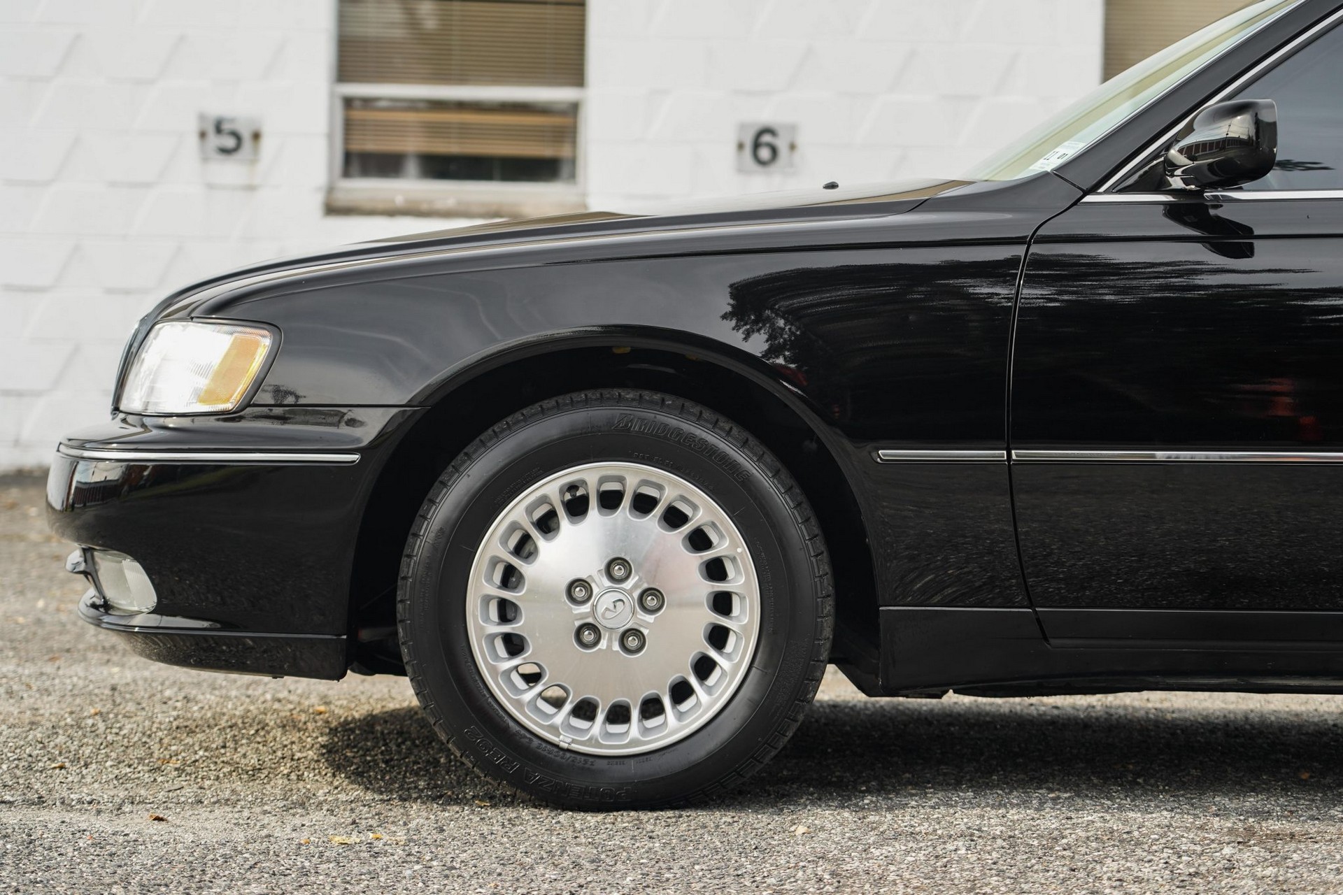 This 17k Mile Infiniti Q45 From 2000 Comes Complete With A Motorola Flip Phone