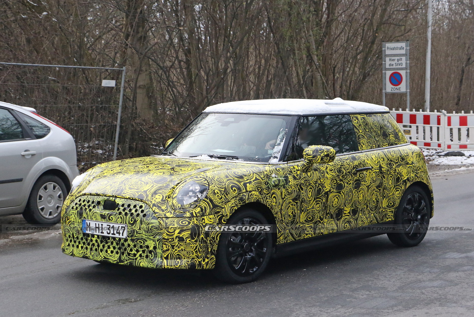 What Is MINI Testing Under The Body Of Current Hatch?