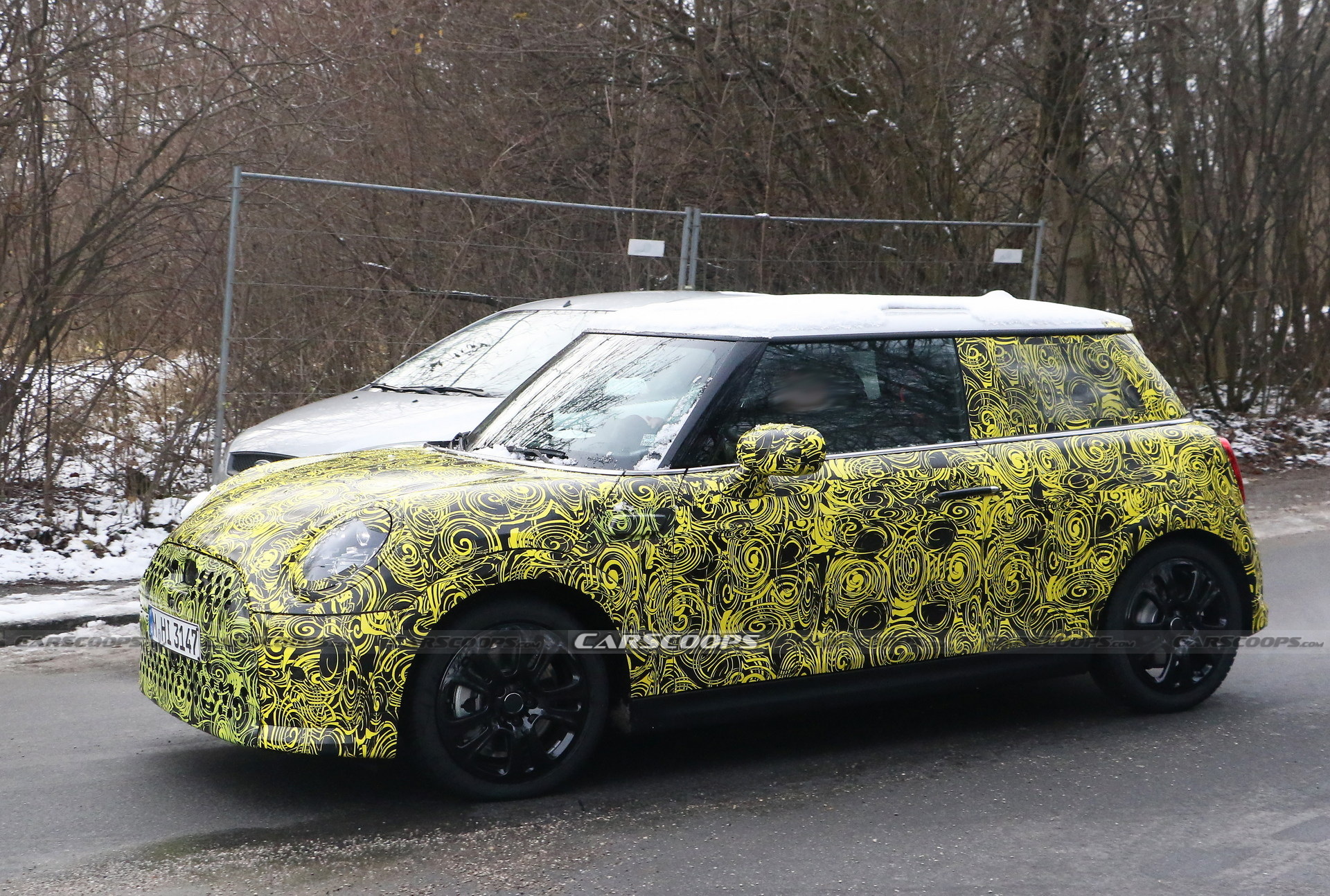 What Is MINI Testing Under The Body Of Current Hatch?