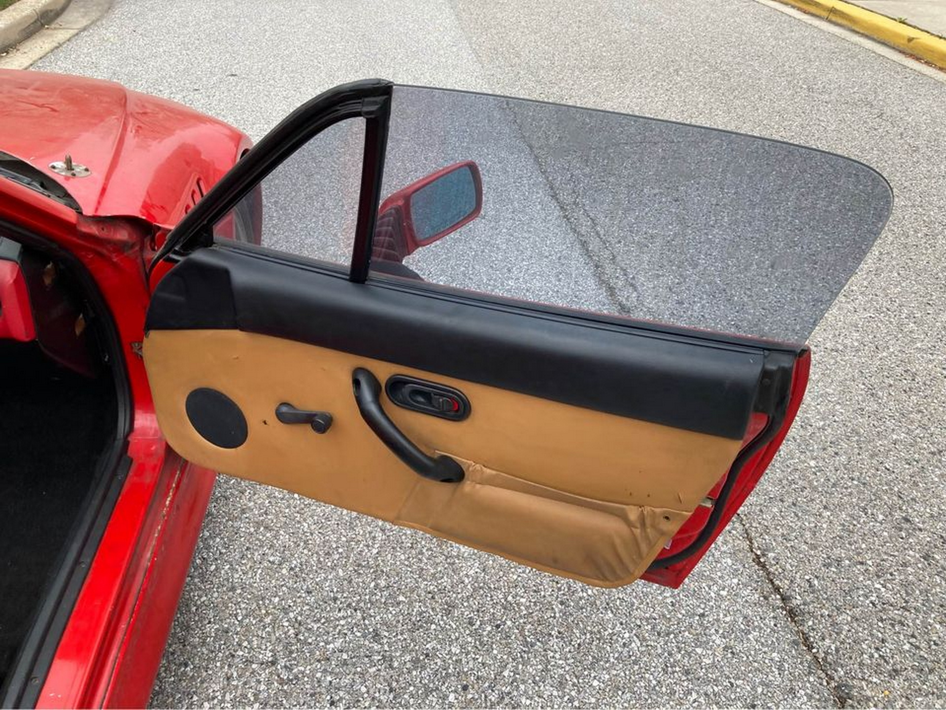 A First Gen Mazda MX-5 Does A Not-So-Convincing BMW Z3 Impersonation