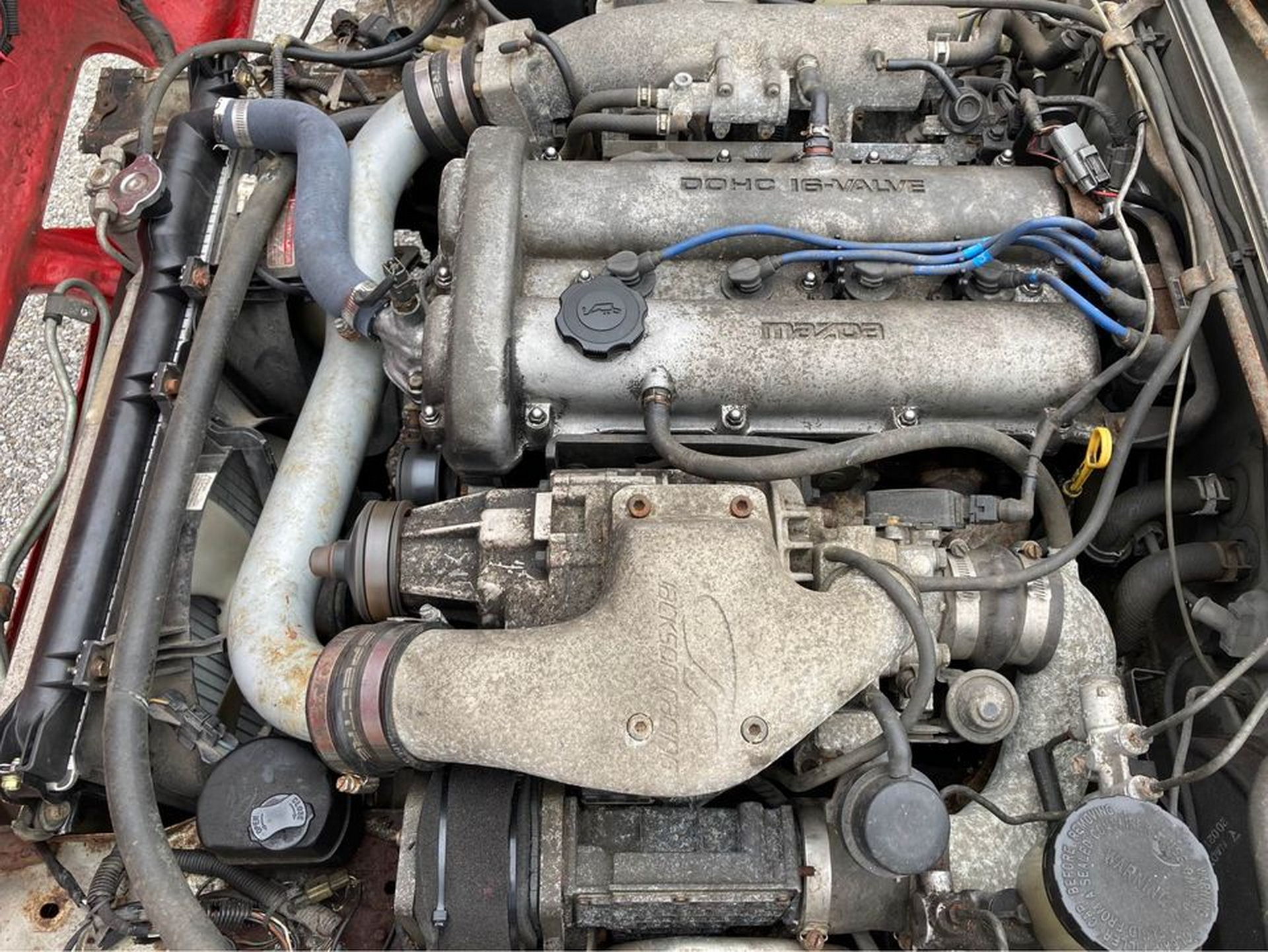 A First Gen Mazda MX-5 Does A Not-So-Convincing BMW Z3 Impersonation