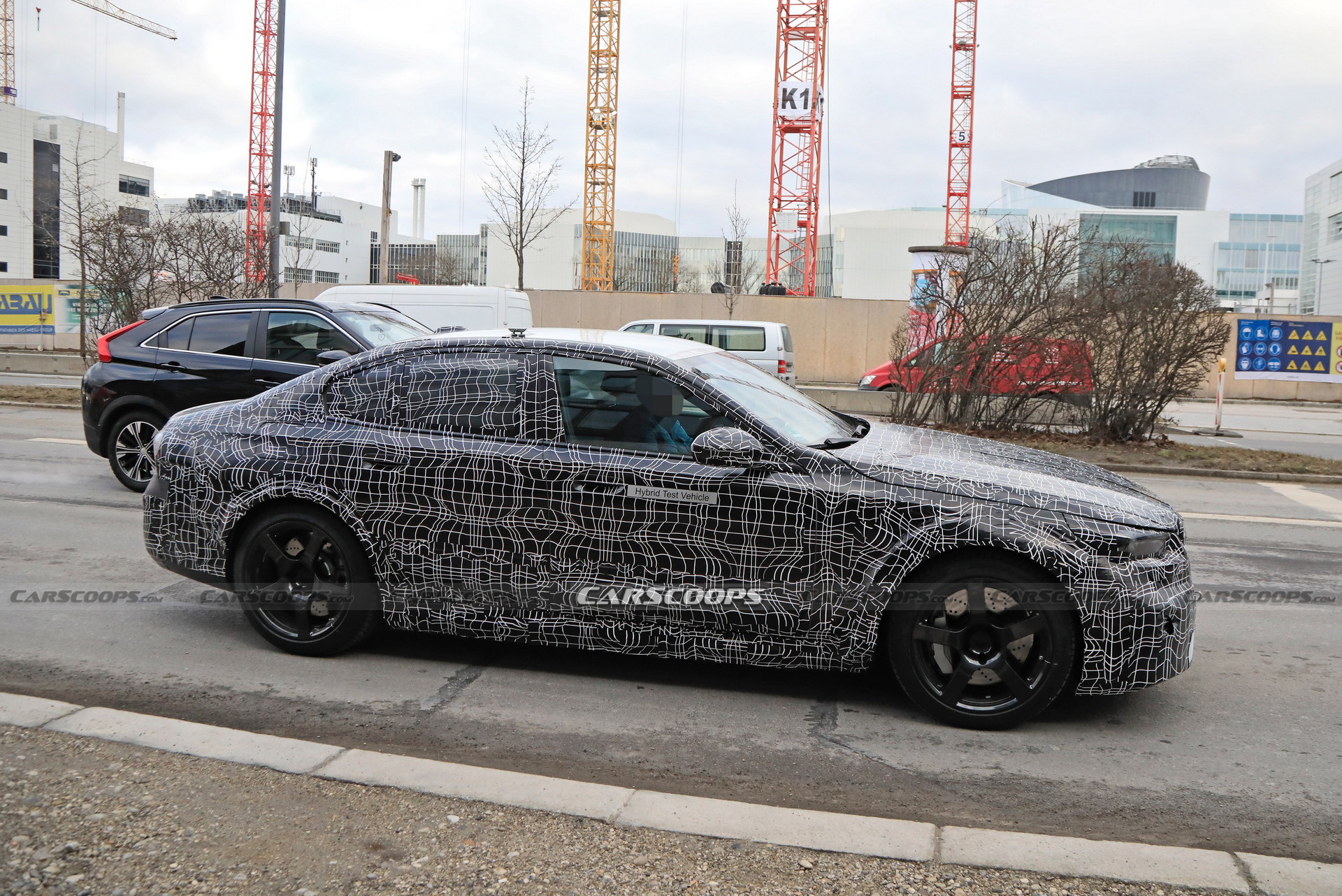 2025 BMW M5 Hybrid Makes Spy Debut Showing Its Aggressive Bodykit